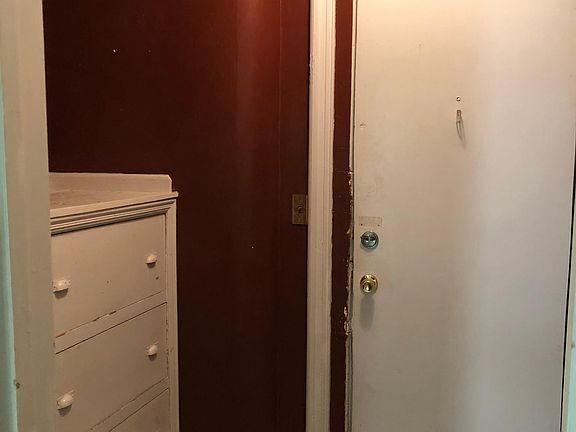 Front entrance to the unit. Built in drawers in the entryway.