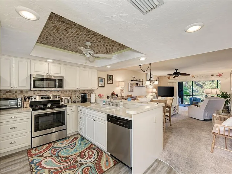 Big kitchen, better vacations. _ Forget cramped condo kitchens_this space is wide open and fully upgraded. Between the massive counter space and the beautiful new cabinetry, you have all the room you need to whip up a feast after a long day at the beach.