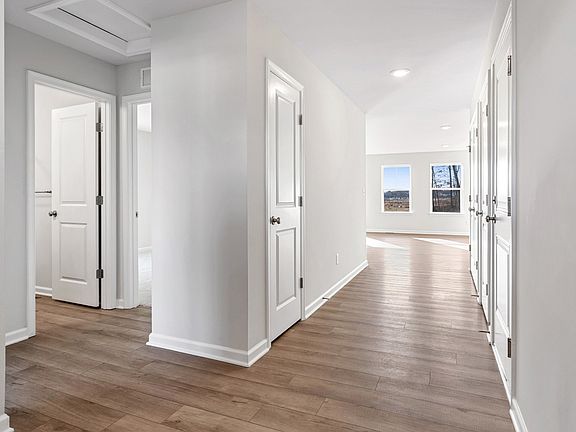 Entry with vinyl plank flooring throughout 1st floor in a DRB Homes Cranberry II plan at The Village
