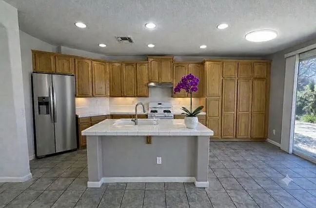 Open kitchen with huge island and plenty of storage