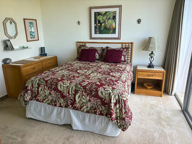 The bedroom is cozy with a comfortable bed.