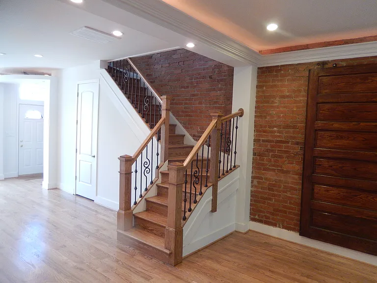 Ornately decorated stair case, Decorative door and storage closet.