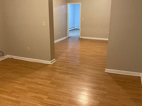 View from living room into dining room and kitchen