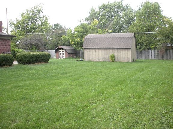 The back yard offers 2 barns.