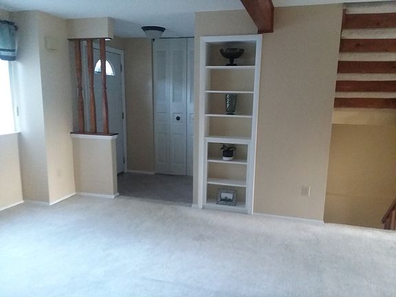 Tile entry, built in shelves