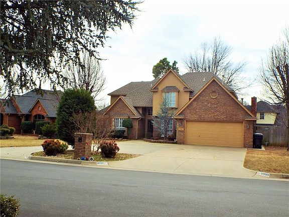 Front with brick mailbox and circle drive.