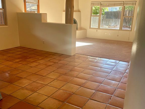 Dinning are with a beautiful Saltillo tile and nice Santa Fe style vigas