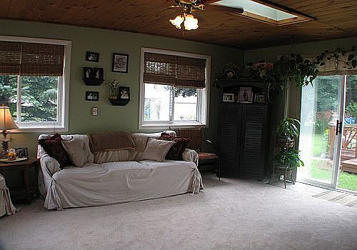 Back sun room with skylights and slider to deck