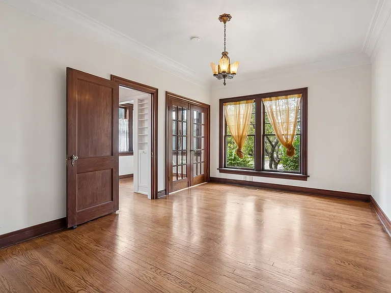 Formal dining room. Double doors on far left open to dining nook. Near left door to kitchen