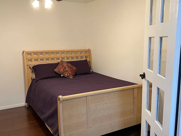 Bedroom 2 with fan and french doors