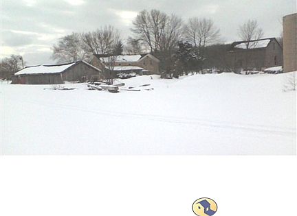 looking west at garage, house, grainery