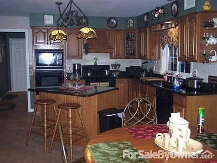 EAT IN KITCHEN : Oak cabinets, Granite Countertops, Custom Tile Floor