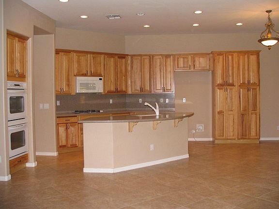 Bright and efficient island kitchen for memorable family get-togethers.