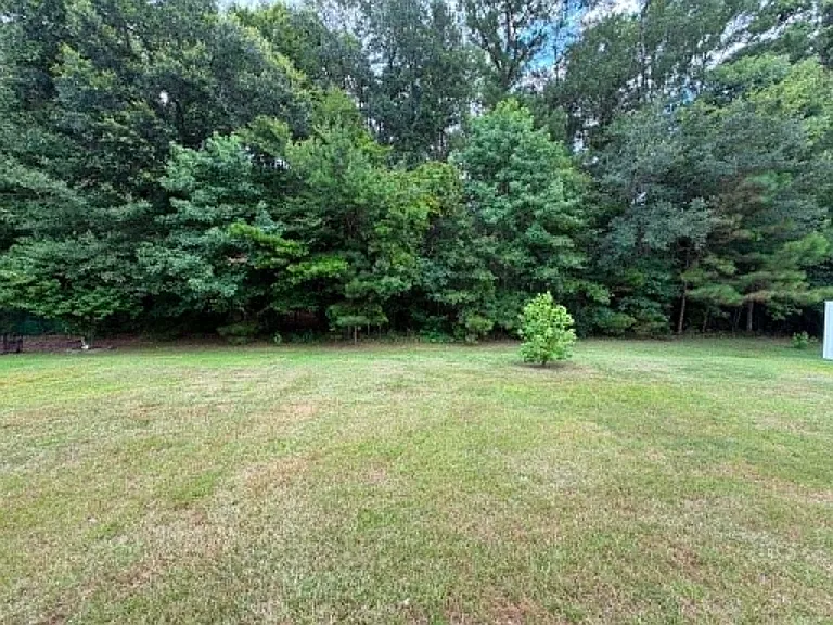 No rear neighbors, just a quiet natural setting to enjoy year-round.