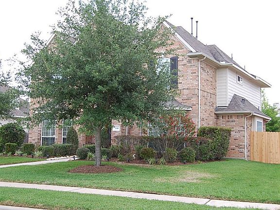 Another view of house. Notice new fence just installed on side of house.