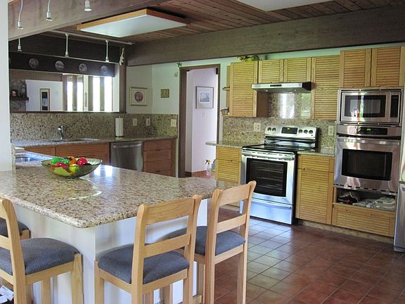 The kitchen has new granite counter tops and new stainless steel appliances