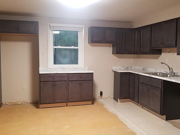 Kitchen cabinets before flooring and appliances