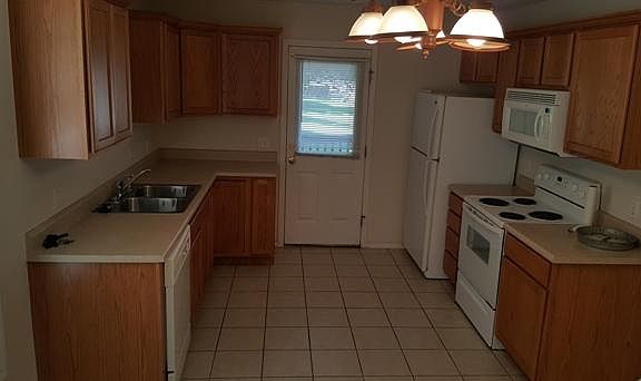 Kitchen with lots of cabinet space and tile floors