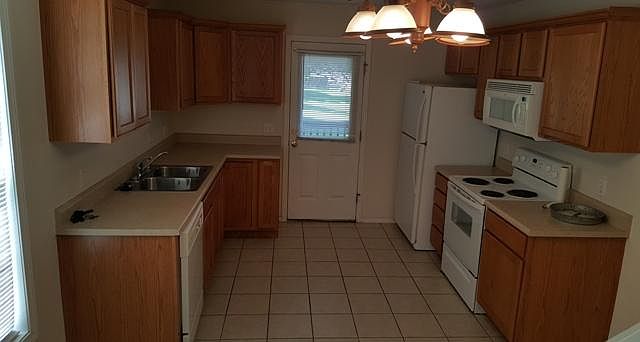 Kitchen with lots of cabinet space and tile floors