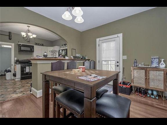 Dinning room and bar seats to kitchen
