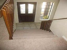 Warm and welcoming entry with upgraded front door!