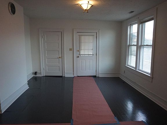 Living Room With Side Porch overlooking Anderson Street and Downtown