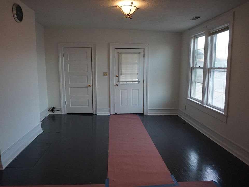 Living Room With Side Porch overlooking Anderson Street and Downtown