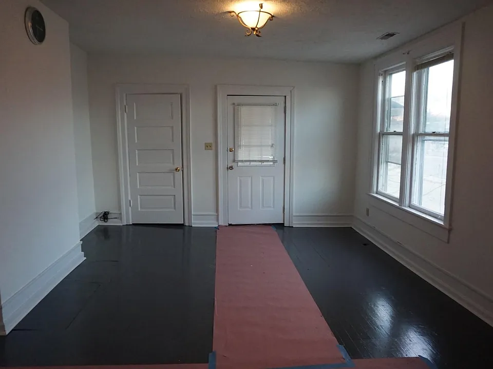 Living Room With Side Porch overlooking Anderson Street and Downtown