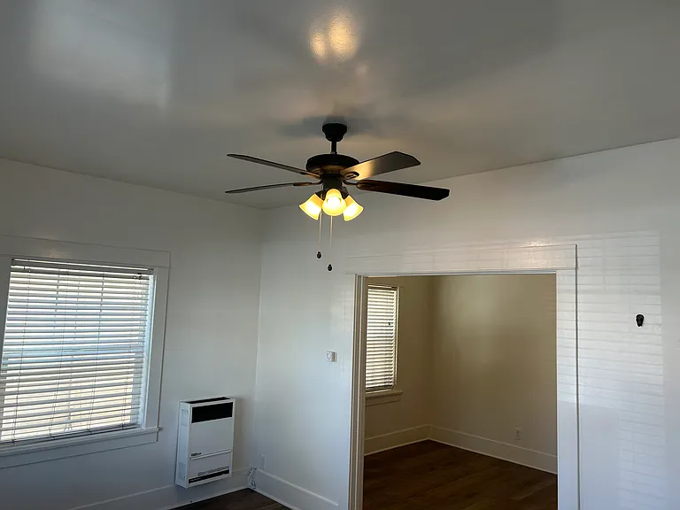 loft style bedroom with a barn door
divider