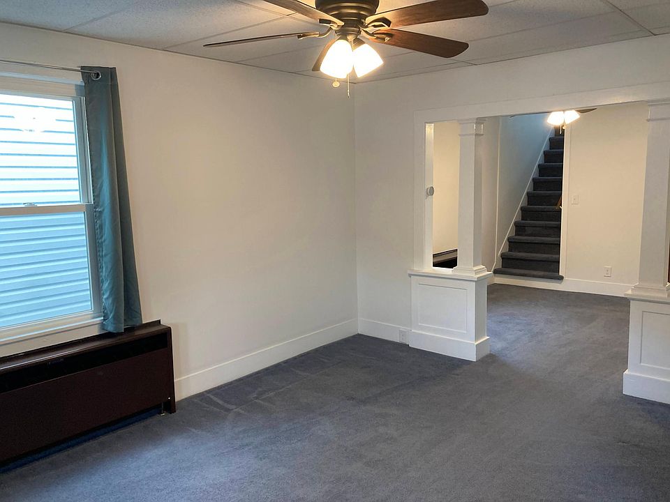 Living Room, Dining Room, and stairs to the upstairs bedrooms with beautiful charm.