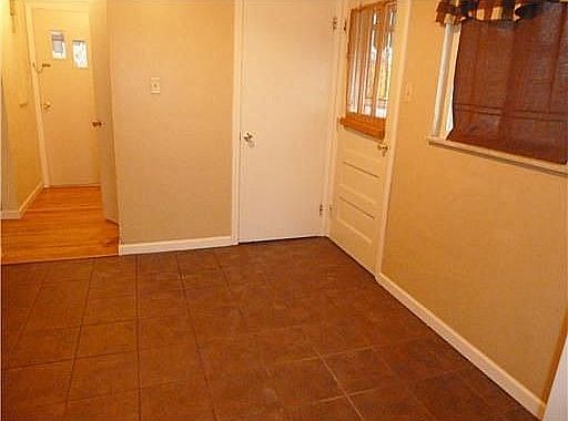 The kitchen has plenty of space for a table and chairs.