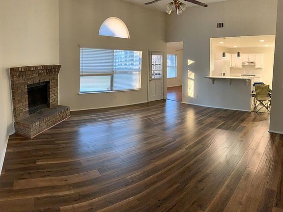 Home opens to spacious living room and open floor plan with gorgeous natural lighting.