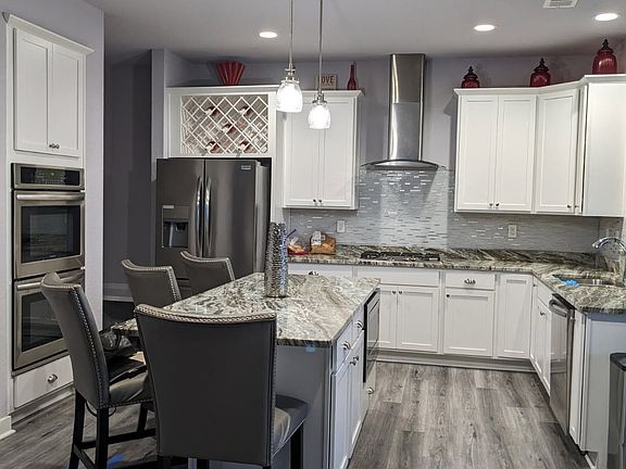 Kitchen showing most of the appliances and the wine rack