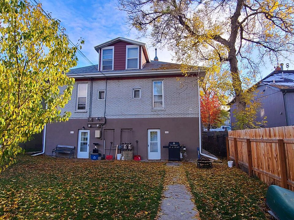 Apartment is in lower portion of 4plex & has a large shared backyard and dedicated off-street parking via alley.