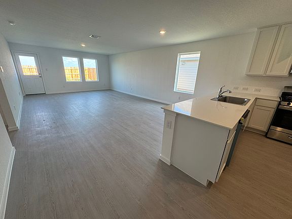 Living area and kitchen (photo of sister property)