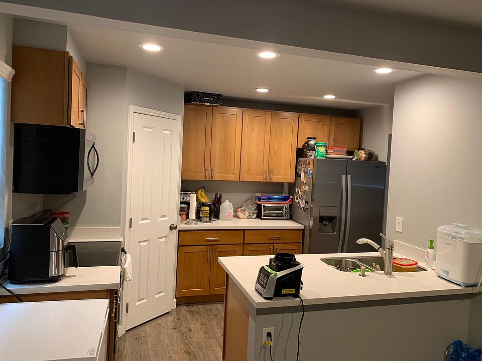 Kitchen with stainless steel appliances. Dish washer not in view