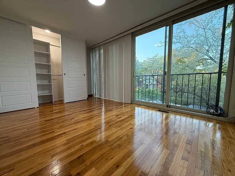 Bedroom 1, with plenty of closet space, floor to ceiling windows