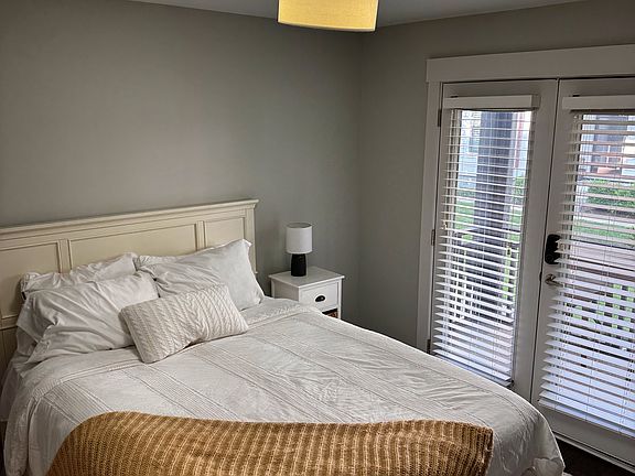 1st floor bedroom with a screened in porch to accompany