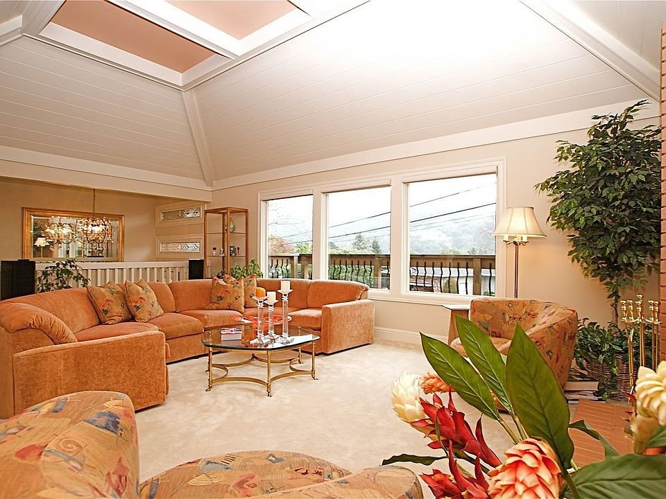 LR with soaring ceilings & picture windows to capture the views!