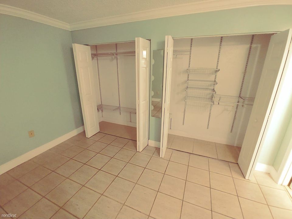 Large master bedroom with wall-to-wall closet.
