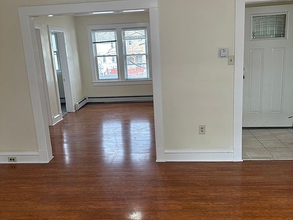 View to dining room and entryway from living room