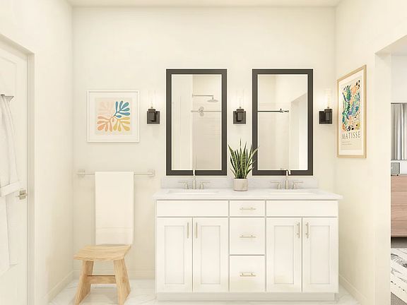 Primary bath with black-framed mirrors