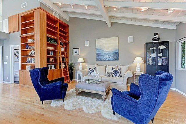 Great Room Living Area with Custom Built-In Bookcase and Hardwood Floors