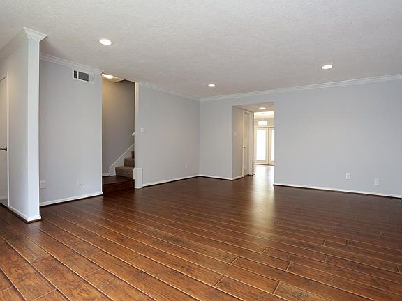 When you enter you are greeted by a large spacious living area which features beautiful flooring tha