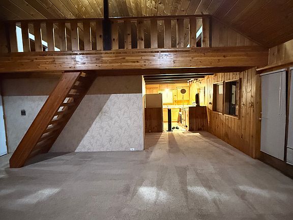 Living room, loft above, kitchen