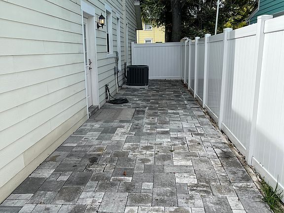 View of the Courtyard from the driveway toward the front yard.
