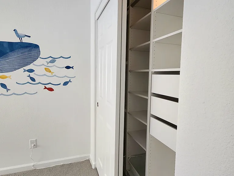 Custom closet in secondary bedroom