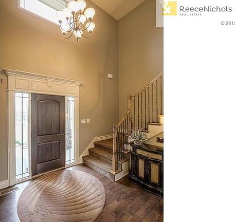 ATTRACTIVE 2-STY ENTRY WITH UPGRADED WOOD FLOORS