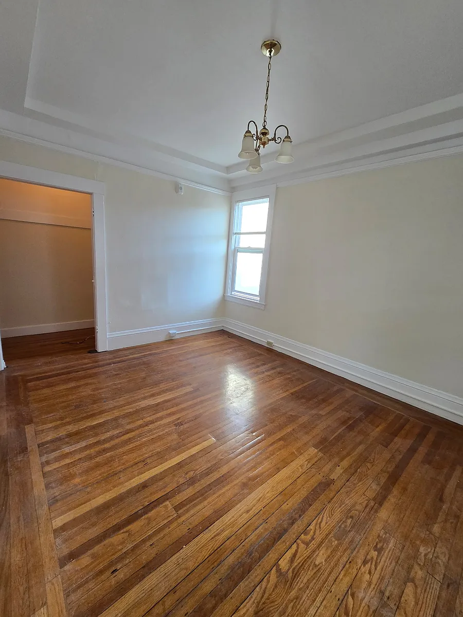 Living room with view of closet/office - Stow Apartments