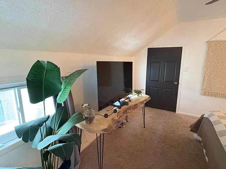 Primary bedroom gets great light; has a flex space off of the bedroom through the door.